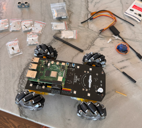 An robotic car kit being assembled on a table